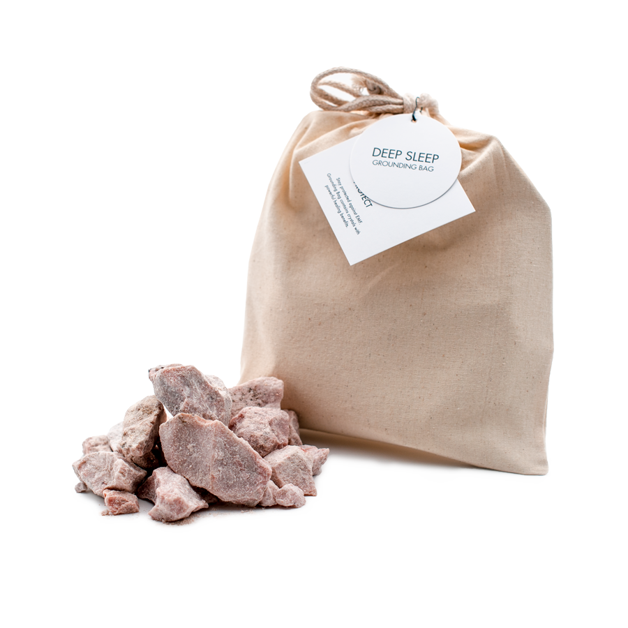 Close-up of pink Tesla crystals inside Deep Sleep Grounding Bag showing natural hand-mined minerals for EMF protection