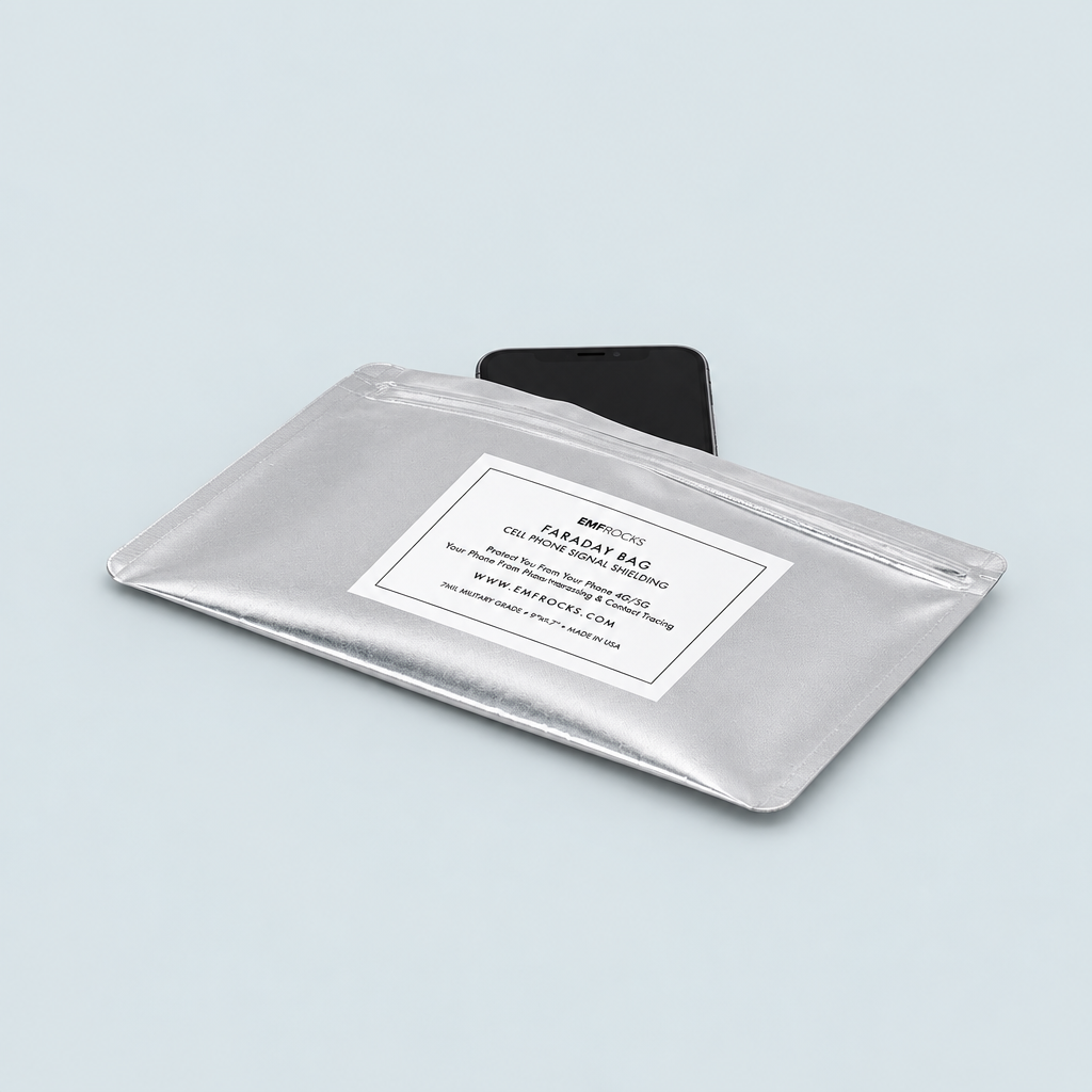 Silver EMF Rocks phone Faraday bag with a black smartphone partly inserted on a pale blue-gray background