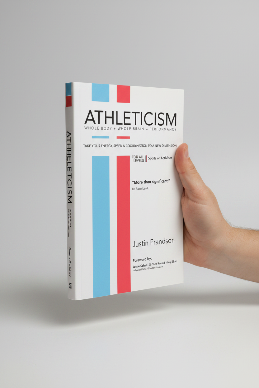 Athleticism softcover book by Justin Frandson held in one hand against a clean light background showing the book's physical size